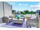 Outdoor patio furniture set with colorful pillows and greenery at 604 Cassidy Ct, Clover, SC 29710