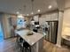 Spacious kitchen features stainless steel appliances, granite countertops and a large center island at 612 Cassidy Ct, Clover, SC 29710