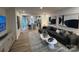 Open-concept living room with a large sofa, stylish decor, and easy access to the kitchen at 612 Cassidy Ct, Clover, SC 29710