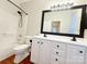 Double vanity bathroom with large mirror and hardwood floors at 6726 Mallard Park Dr, Charlotte, NC 28262