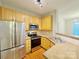 Well-equipped kitchen featuring light wood cabinets and stainless steel appliances at 6726 Mallard Park Dr, Charlotte, NC 28262