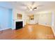 Living room with hardwood floors, fireplace, and open concept design at 6726 Mallard Park Dr, Charlotte, NC 28262