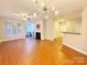 Open living area with hardwood floors, fireplace and high ceilings at 6726 Mallard Park Dr, Charlotte, NC 28262