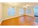 Spacious living room with hardwood floors and large windows at 6726 Mallard Park Dr, Charlotte, NC 28262