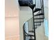 Modern spiral staircase leading to upper level at 6726 Mallard Park Dr, Charlotte, NC 28262