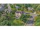 Stunning aerial view of a house with solar panels, a patio, and lush landscaping at 712 Springwood Dr, Waxhaw, NC 28173