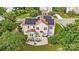 Aerial view of home with solar panels, a patio area, and a well-manicured lawn at 712 Springwood Dr, Waxhaw, NC 28173