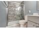 Updated bathroom featuring a tiled shower with glass enclosure, modern fixtures, and neutral color palette at 712 Springwood Dr, Waxhaw, NC 28173