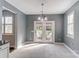 Cozy breakfast area with tiled floors, large windows, and French doors leading to outdoor space at 712 Springwood Dr, Waxhaw, NC 28173