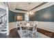 Dining area with table setting, dark hardwood flooring, and decorative molding at 712 Springwood Dr, Waxhaw, NC 28173