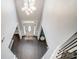 Open foyer featuring hardwood floors, high ceilings, and a stylish light fixture at 712 Springwood Dr, Waxhaw, NC 28173