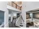 Grand foyer with hardwood floors, staircase, and open view of the living spaces at 712 Springwood Dr, Waxhaw, NC 28173