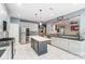 Modern kitchen with stainless steel appliances, a large island, and white cabinetry at 712 Springwood Dr, Waxhaw, NC 28173