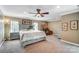 Spacious main bedroom boasts a sitting area, ceiling fan, and carpeted floors at 712 Springwood Dr, Waxhaw, NC 28173