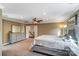 Open main bedroom features neutral walls, ceiling fan, and access to upstairs at 712 Springwood Dr, Waxhaw, NC 28173