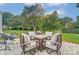 Stone patio featuring comfortable chairs around an outdoor coffee table, perfect for entertaining guests at 712 Springwood Dr, Waxhaw, NC 28173