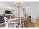 Open-concept dining room flows seamlessly into the living room and study, perfect for entertaining guests at 7552 Hartsfield Dr, Lancaster, SC 29720