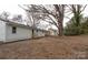 Spacious backyard with mature trees and side yard view at 809 Miller St, Gastonia, NC 28052