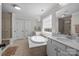 This spacious primary bathroom features double sinks, a soaking tub, and a separate shower enclosure at 840 Pecan Tree Ln, Fort Mill, SC 29715