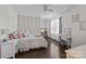 This bedroom features decor panelling, hardwood floors, and is brightly lit by natural light at 840 Pecan Tree Ln, Fort Mill, SC 29715