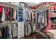This walk-in closet includes shelving and rods for ample storage space, and hardwood floors at 840 Pecan Tree Ln, Fort Mill, SC 29715