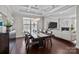 Elegant dining room with coffered ceiling and modern chandelier connecting to the living room at 840 Pecan Tree Ln, Fort Mill, SC 29715
