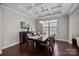 Elegant dining room with coffered ceiling and modern chandelier at 840 Pecan Tree Ln, Fort Mill, SC 29715