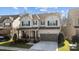 Charming two-story home featuring a covered front porch and a two-car garage at 840 Pecan Tree Ln, Fort Mill, SC 29715