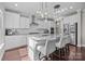 Modern kitchen with stainless steel appliances, granite counters, and island with bar seating at 840 Pecan Tree Ln, Fort Mill, SC 29715