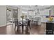 Open kitchen with granite island, stainless steel appliances, and breakfast nook with deck access at 840 Pecan Tree Ln, Fort Mill, SC 29715