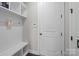 Mud room featuring built in storage bench, coat hooks, and a clean and simple design at 840 Pecan Tree Ln, Fort Mill, SC 29715