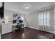 This home office features hardwood floors, crown moulding, and great natural light at 840 Pecan Tree Ln, Fort Mill, SC 29715