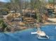 Charming waterfront home with a private dock, expansive deck, and lush landscaping at 1077 Gauguin Ln, Tega Cay, SC 29708