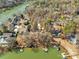 Aerial view of the waterfront home with lake access, private dock, and landscaped backyard, a lake lover's dream at 1077 Gauguin Ln, Tega Cay, SC 29708