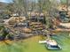 Waterfront home with dock, patio, and outdoor living spaces from an aerial view at 1077 Gauguin Ln, Tega Cay, SC 29708