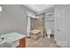 Modern bathroom featuring a soaking tub and separate shower at 1077 Gauguin Ln, Tega Cay, SC 29708