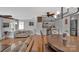 Spacious open living area with a bar, hardwood floors, and a ceiling fan, perfect for gatherings at 1077 Gauguin Ln, Tega Cay, SC 29708