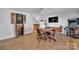 A well-lit living room features a retro game arcade, dart board and a table for playing games at 1077 Gauguin Ln, Tega Cay, SC 29708