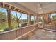 Screened-in porch with ceiling fan offers stunning waterfront views and inviting outdoor living at 1077 Gauguin Ln, Tega Cay, SC 29708