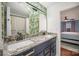 Bathroom boasts a double vanity with granite countertops at 1304 Armstrong Ford Rd, Belmont, NC 28012