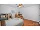 Spacious bedroom with hardwood floors and ceiling fan at 1304 Armstrong Ford Rd, Belmont, NC 28012