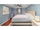 Bright bedroom with a large bed, hardwood floors, and ceiling fan at 1304 Armstrong Ford Rd, Belmont, NC 28012
