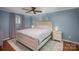 Spacious bedroom with light walls, ceiling fan and hardwood floors at 1304 Armstrong Ford Rd, Belmont, NC 28012