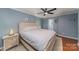 Light and airy bedroom with ceiling fan and hardwood floors at 1304 Armstrong Ford Rd, Belmont, NC 28012