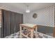 Small dining area with a rustic table and gray patterned walls at 1304 Armstrong Ford Rd, Belmont, NC 28012