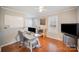Bright home office features hardwood floors, built-in desk, and ample natural light at 1304 Armstrong Ford Rd, Belmont, NC 28012