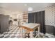 Modern kitchen with stainless steel appliances and a checkerboard floor at 1304 Armstrong Ford Rd, Belmont, NC 28012