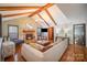 Living room features a stone fireplace, hardwood floors, and ample natural light at 1304 Armstrong Ford Rd, Belmont, NC 28012