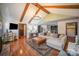 Open living area with vaulted ceiling, hardwood floors, and comfortable seating at 1304 Armstrong Ford Rd, Belmont, NC 28012