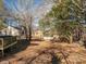 Large backyard with mature trees and a shed at 1316 Neal Hawkins Rd, Gastonia, NC 28056